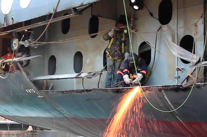 Dry dock yacht maintenance with hull inspection and repair tools